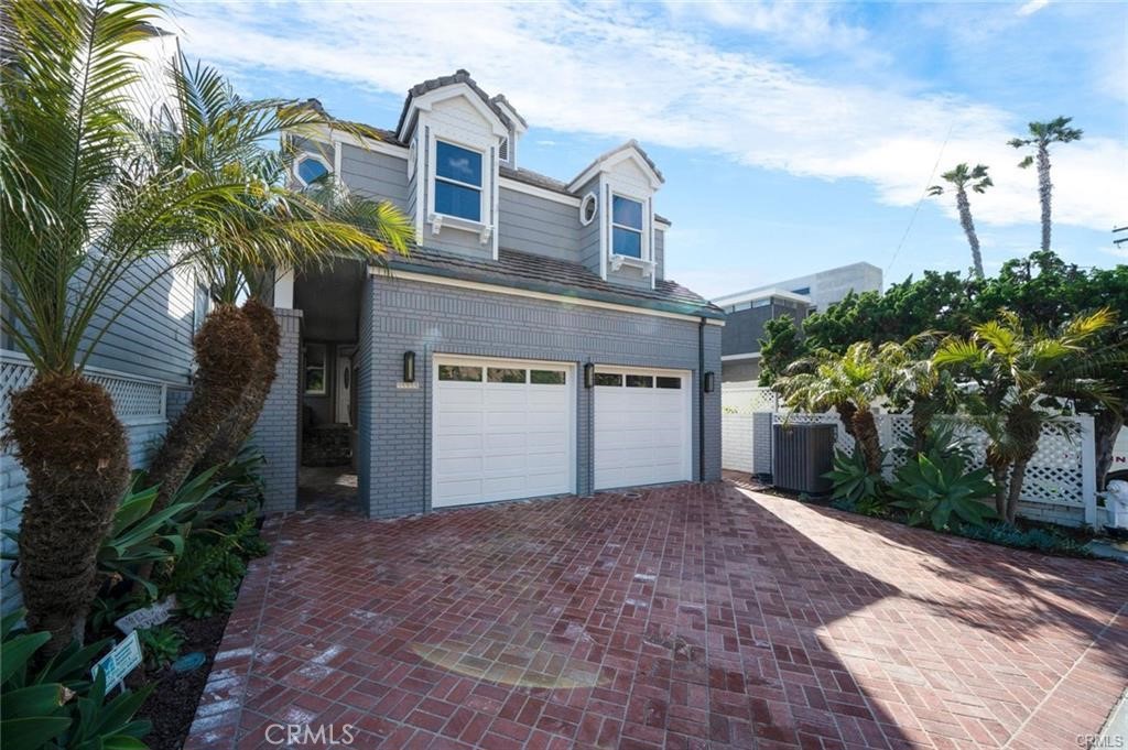 35555 Beach Road Dana Point, CA 92624 - Photo 55 of 68 a front view of a house with a yard and a garage