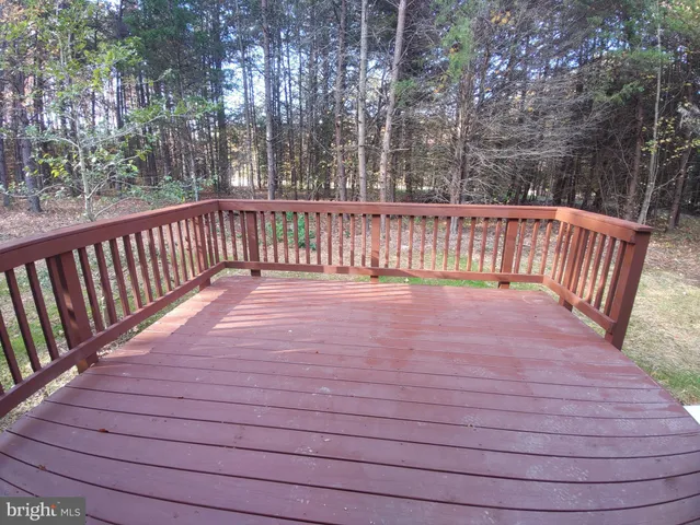 a balcony with trees in the background