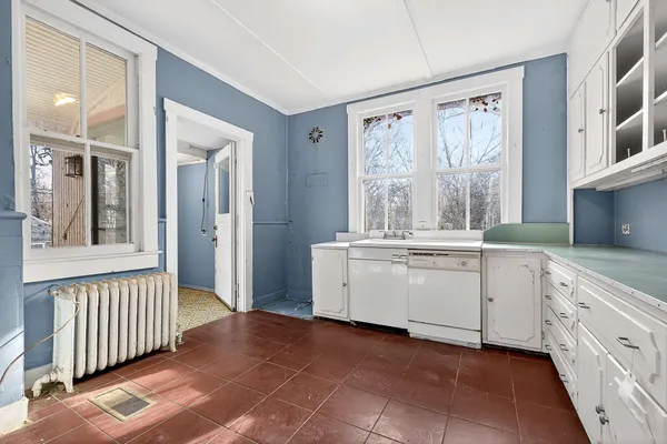 a view of room with window and hallway