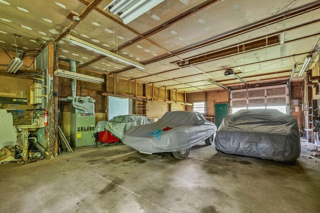 4409 Newton Road Northeast Newark, OH 43055 - Photo 76 of 87 • Stucco exterior • Concrete flooring • Fuel oil furnace (Working order unknown) • Rear garage door • 6-8 car attached garage