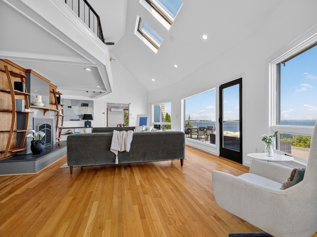 57 Harborview Road Hull, MA 02045 - Photo 14 of 41 a living room with furniture and a wooden floor