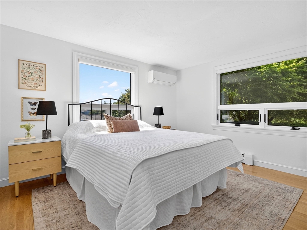 57 Harborview Road Hull, MA 02045 - Photo 17 of 41 a bedroom with a bed and a large window