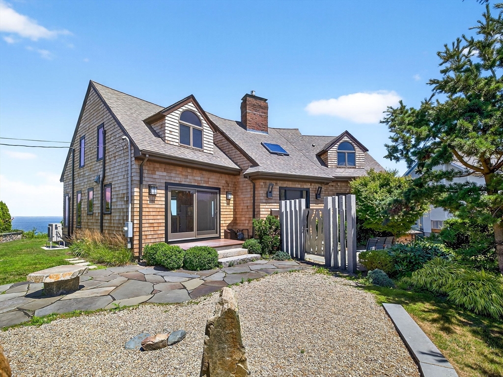 57 Harborview Road Hull, MA 02045 - Photo 2 of 41 a front view of a house with garden