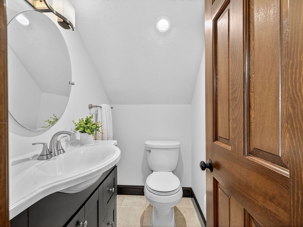 57 Harborview Road Hull, MA 02045 - Photo 23 of 41 a bathroom with a sink and a toilet