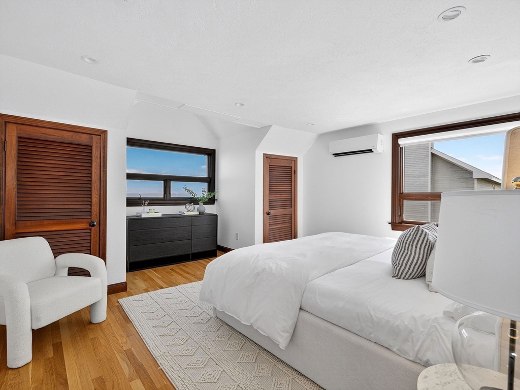 57 Harborview Road Hull, MA 02045 - Photo 25 of 41 a bedroom with a bed and a couch