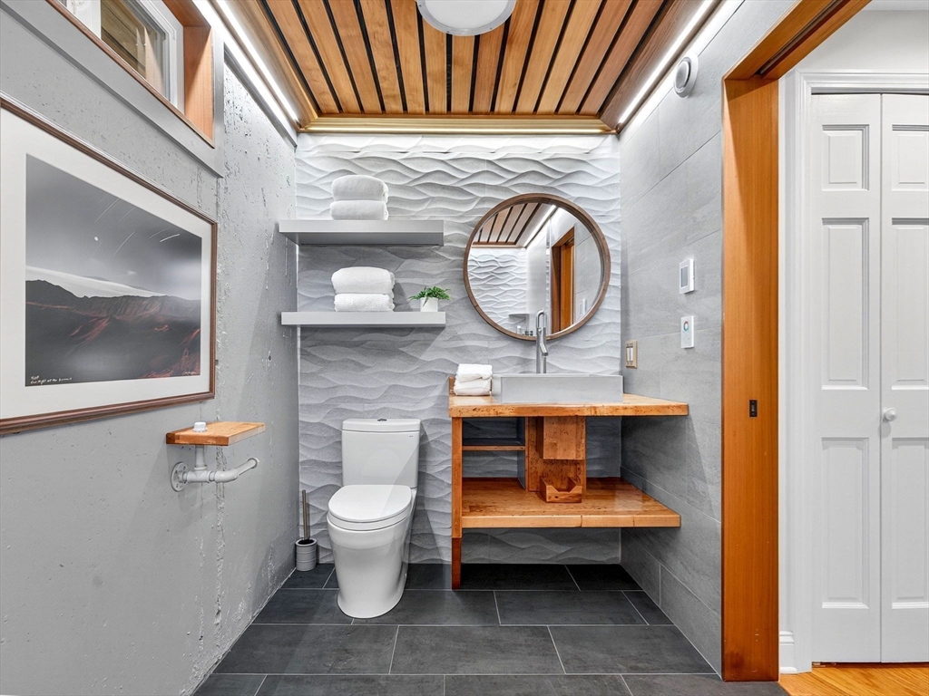 57 Harborview Road Hull, MA 02045 - Photo 31 of 41 a bathroom with a toilet and a sink