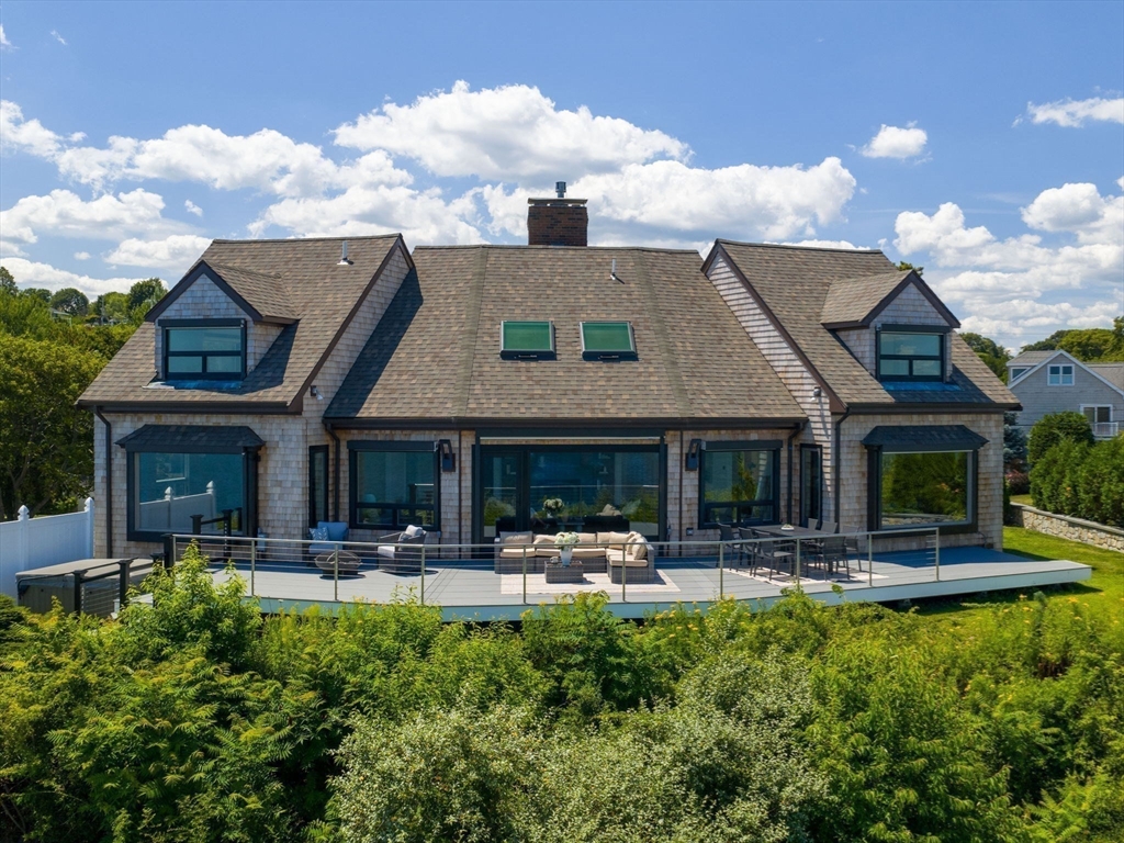 57 Harborview Road Hull, MA 02045 - Photo 36 of 41 a front view of a house with swimming pool and couches