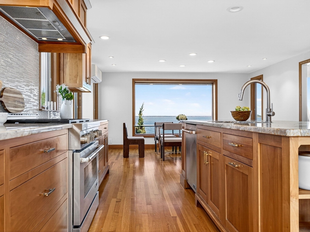 57 Harborview Road Hull, MA 02045 - Photo 6 of 41 a kitchen with counter top space a sink and appliances