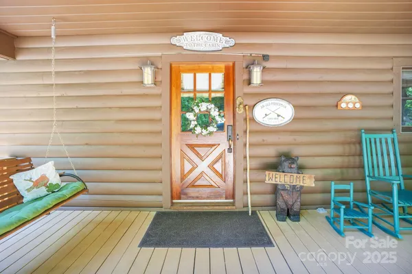a view of a door and wooden floor