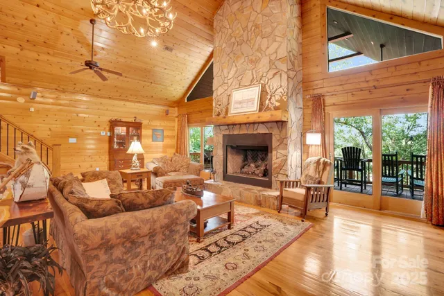 a living room with furniture a fireplace and a table