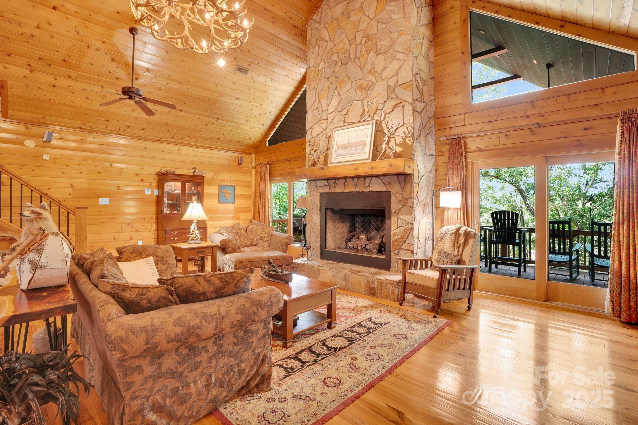 210 Big Rock Road Blacksburg, SC 29702 - Photo 13 of 46 a living room with furniture a fireplace and a table