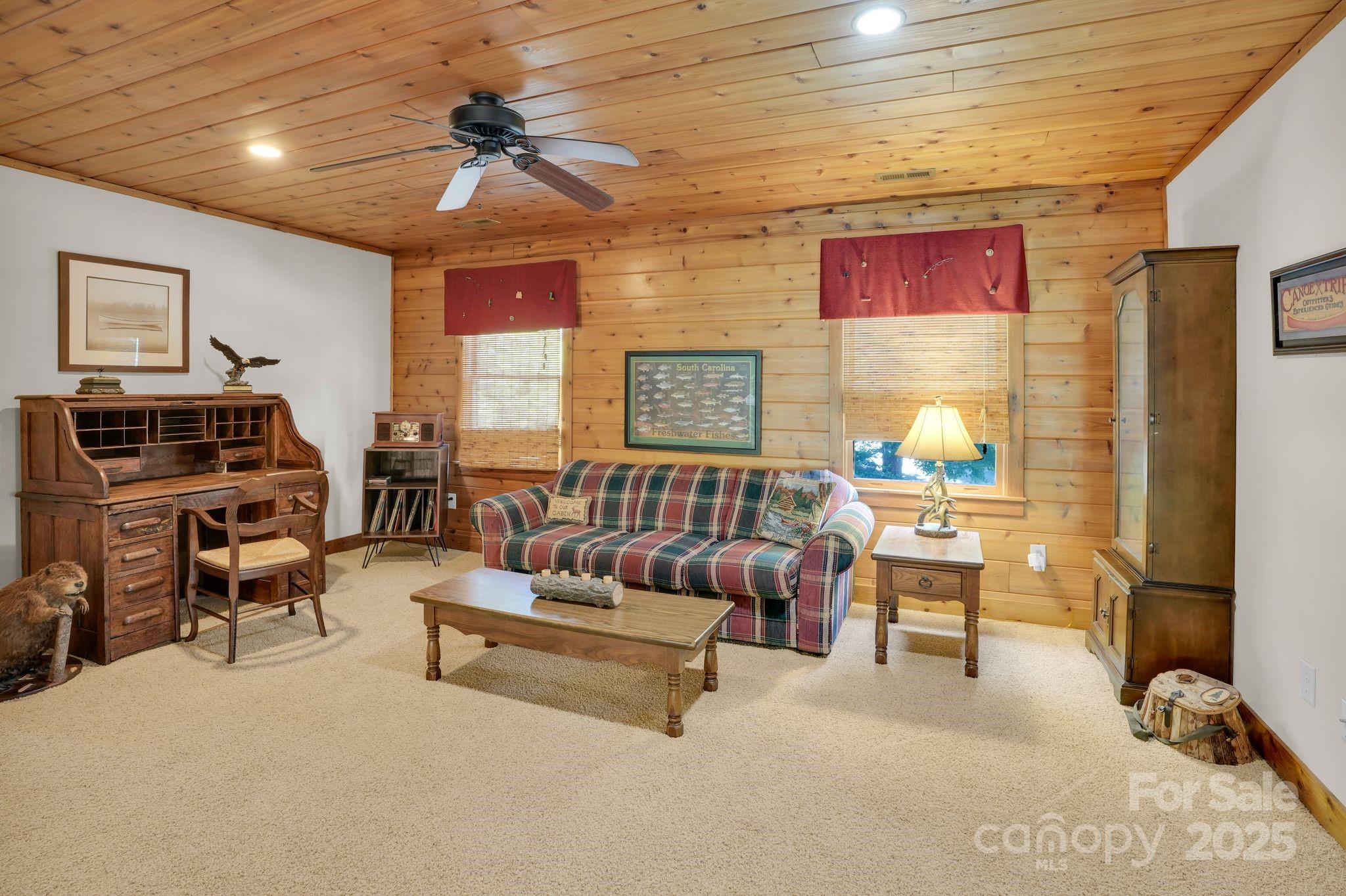 210 Big Rock Road Blacksburg, SC 29702 - Photo 24 of 46 a living room with furniture and a flat screen tv