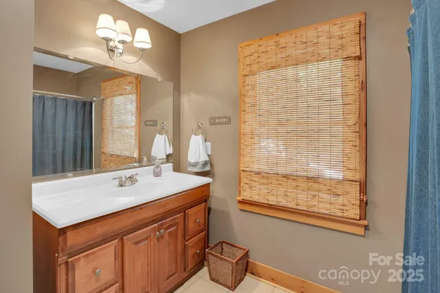 a bathroom with a sink a vanity and a mirror