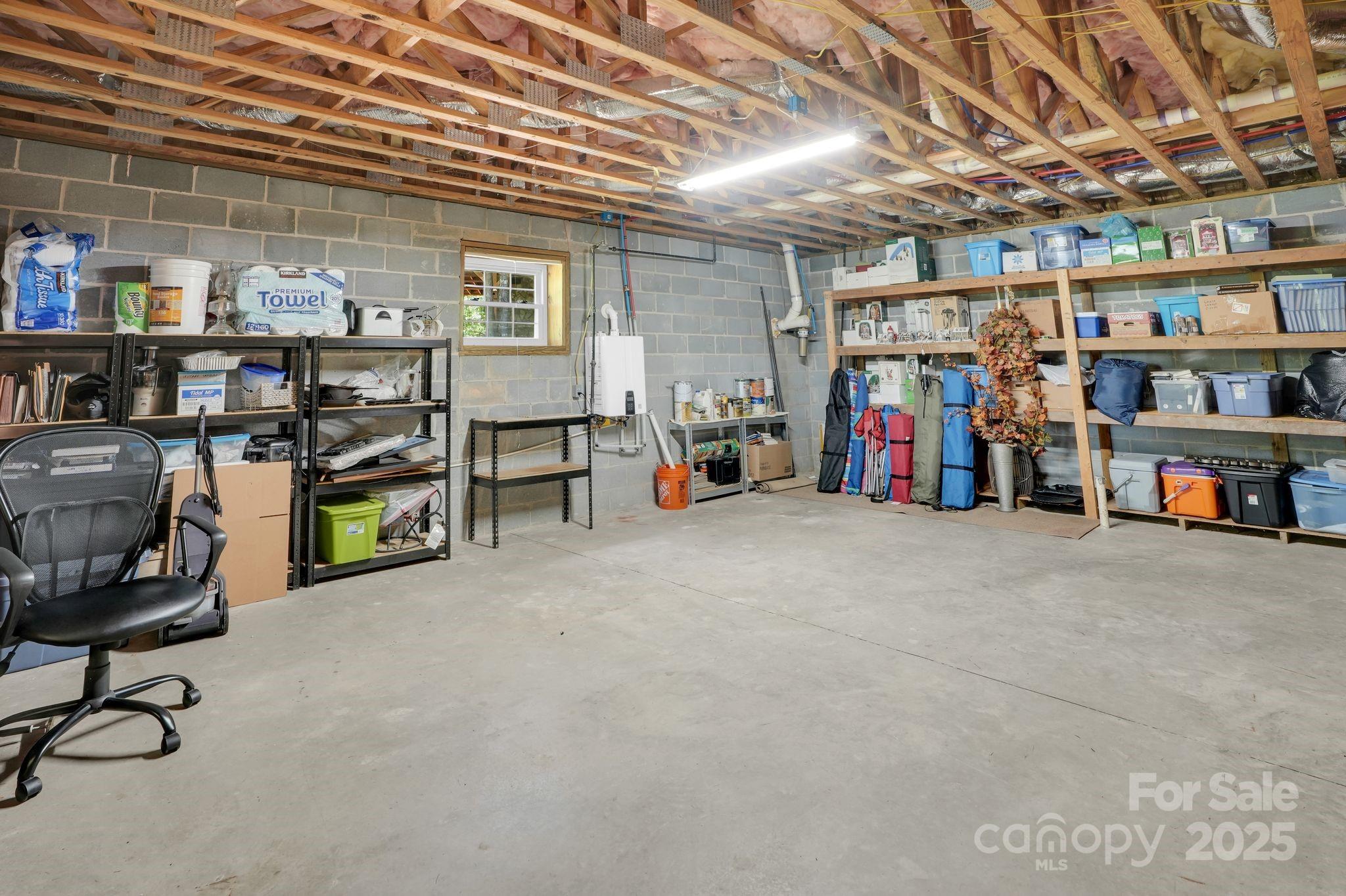 210 Big Rock Road Blacksburg, SC 29702 - Photo 31 of 46 a view of a storage area with shelves