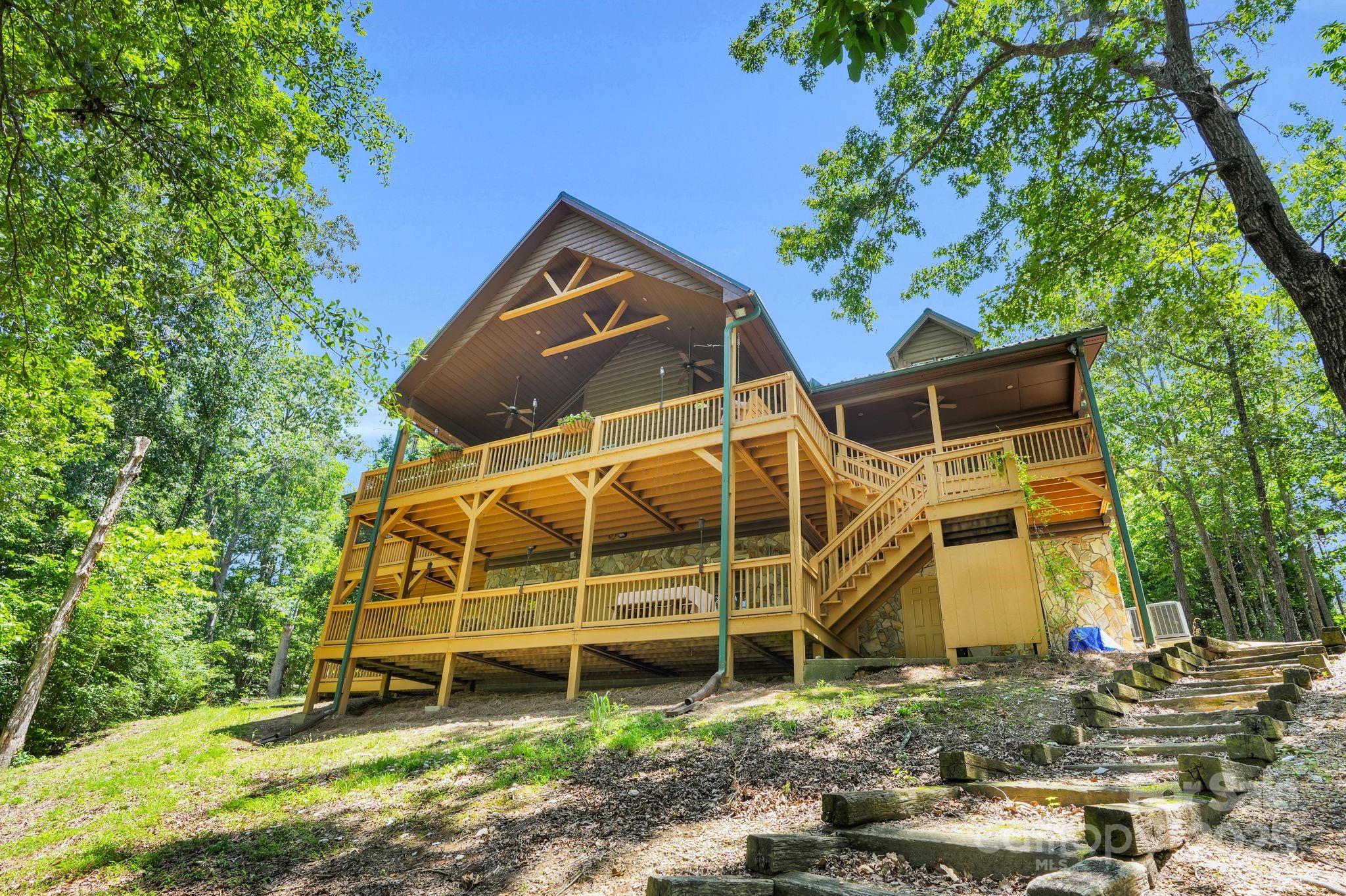 210 Big Rock Road Blacksburg, SC 29702 - Photo 33 of 46 a view of a wooden house with a yard