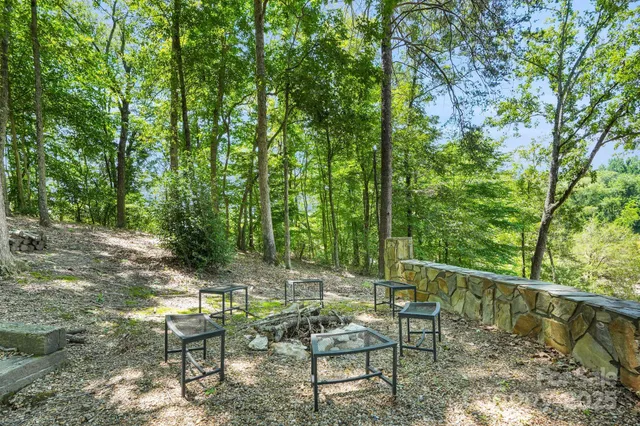 a view of a chairs and table in the patio