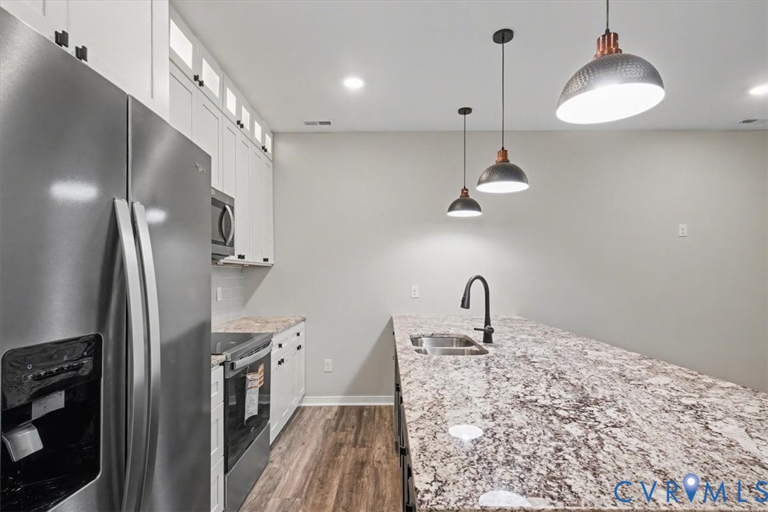 302 Cedar Grove Road Farnham, VA 22460 - Photo 12 of 23 a kitchen with stainless steel appliances a refrigerator sink and cabinets