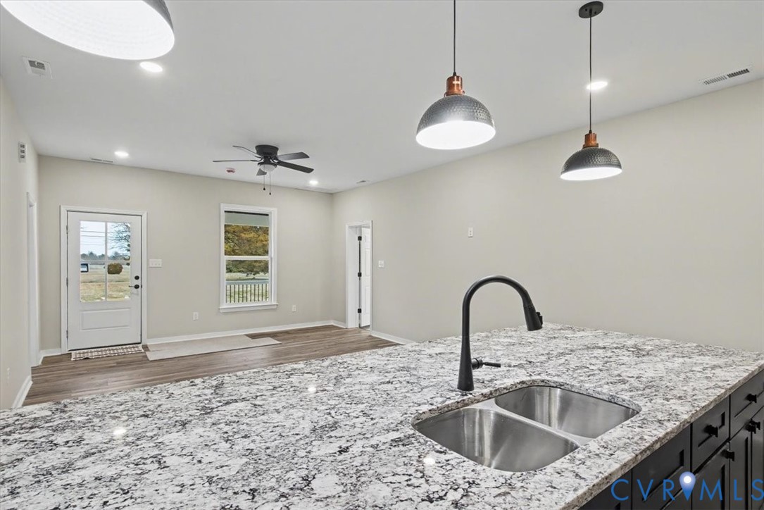 302 Cedar Grove Road Farnham, VA 22460 - Photo 13 of 23 a kitchen with a sink a counter top space and a view of living room
