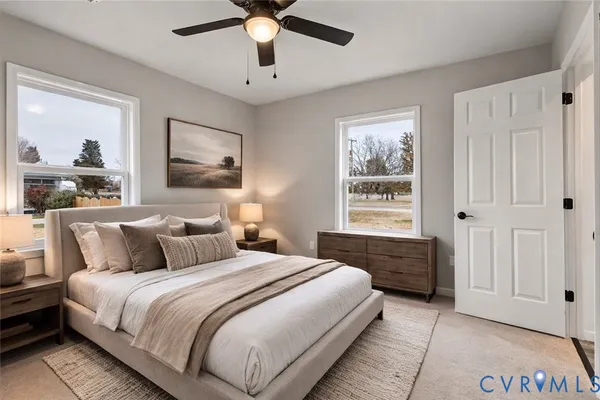 a bedroom with a large bed and a window