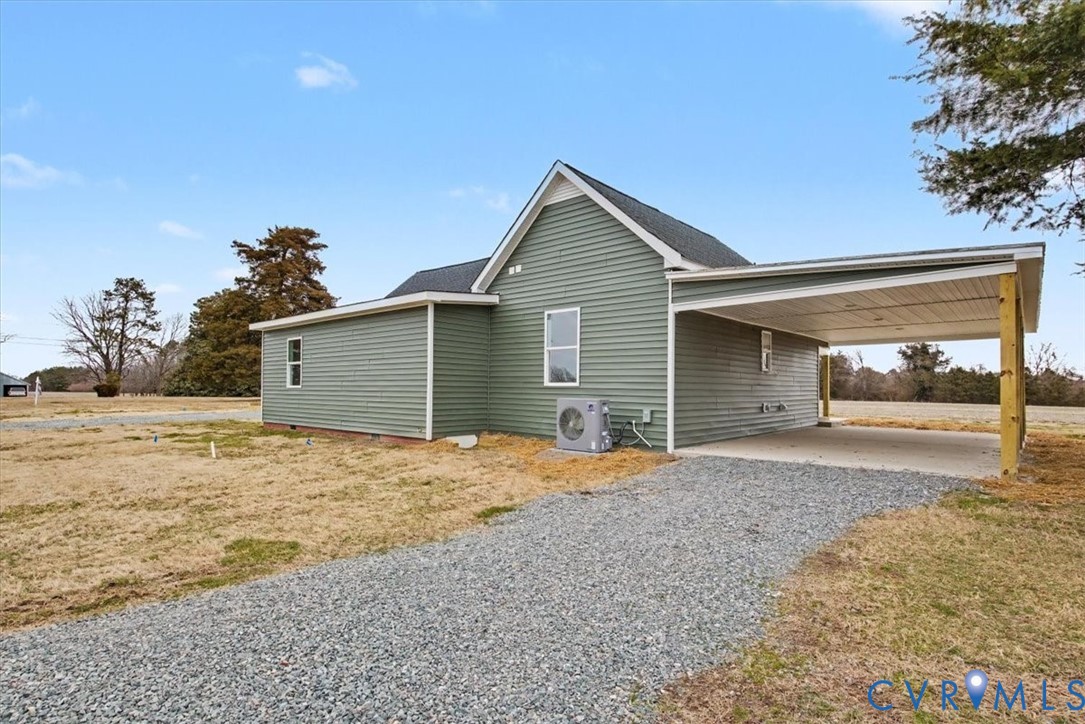 302 Cedar Grove Road Farnham, VA 22460 - Photo 21 of 23 a front view of a house with a yard and garage
