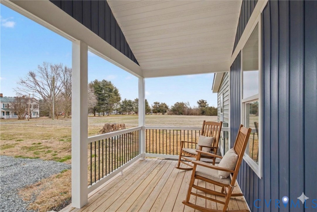 302 Cedar Grove Road Farnham, VA 22460 - Photo 9 of 23 a view of a balcony with wooden floor next to a yard