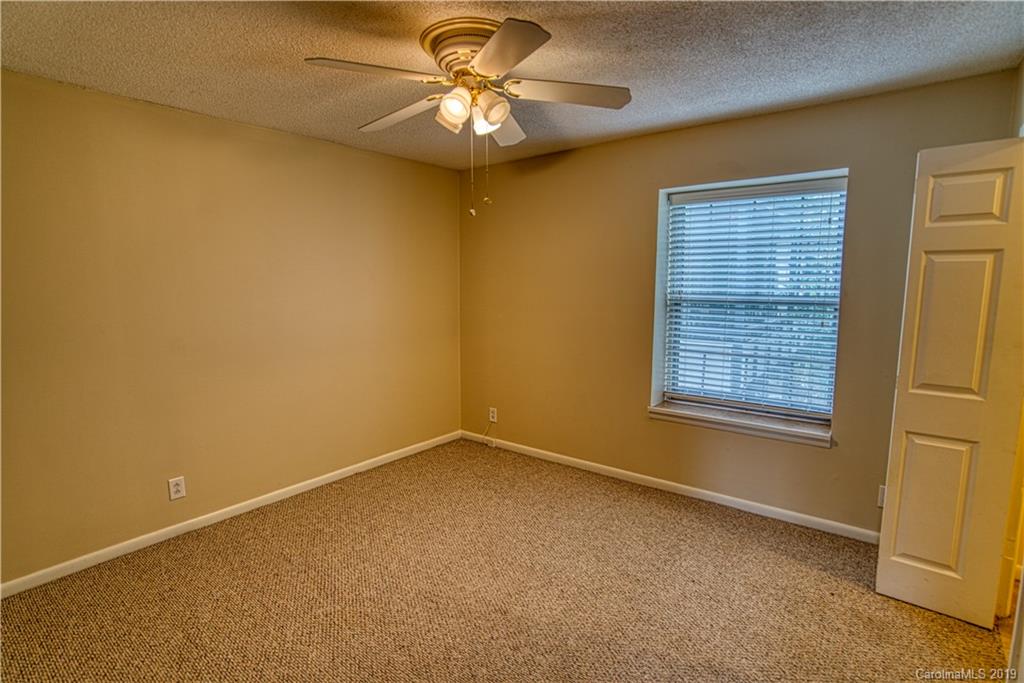 2616 Park Road, Unit H Charlotte, NC 28209 - Photo 16 of 28 a view of an empty room with a window