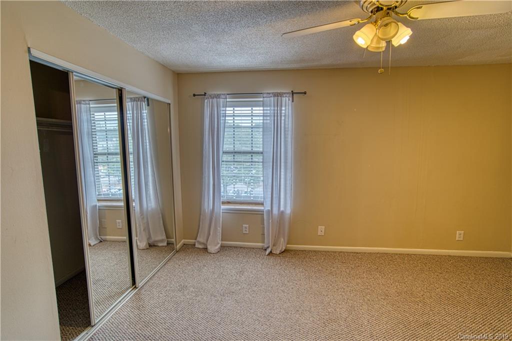 2616 Park Road, Unit H Charlotte, NC 28209 - Photo 22 of 28 an empty room with windows