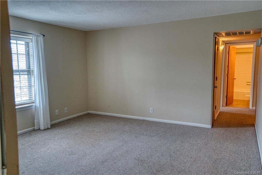 2616 Park Road, Unit H Charlotte, NC 28209 - Photo 5 of 28 an empty room with windows