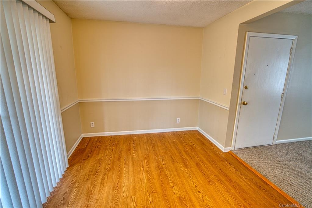 2616 Park Road, Unit H Charlotte, NC 28209 - Photo 8 of 28 a view of a room with wooden floor
