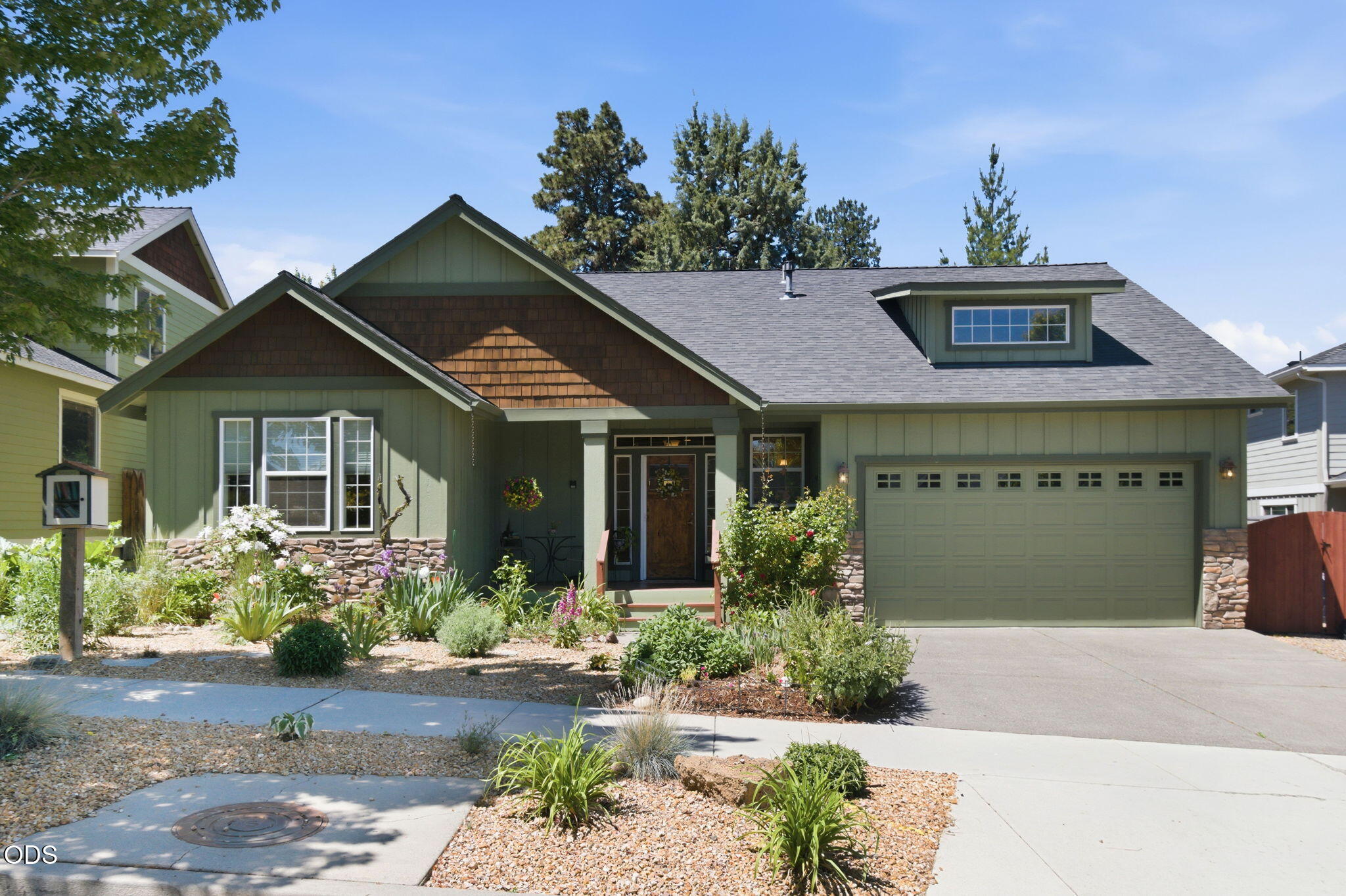 62944 Fresca Street Bend, OR 97703 - Photo 32 of 32 a front view of a house with garden