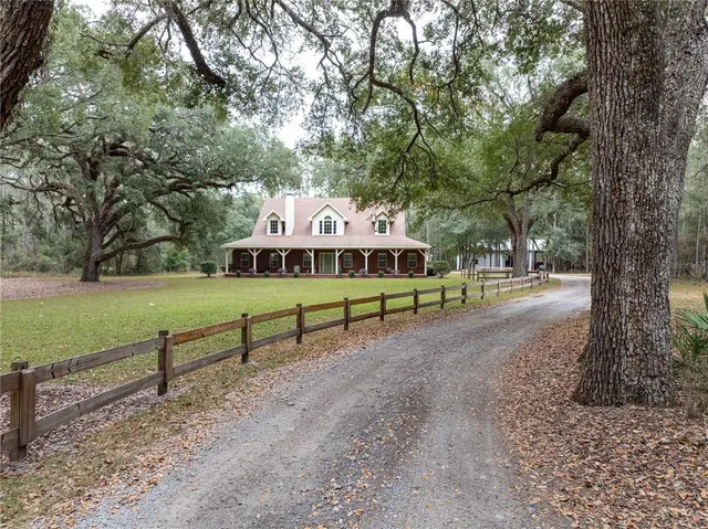 a view of outdoor space with playground and green space