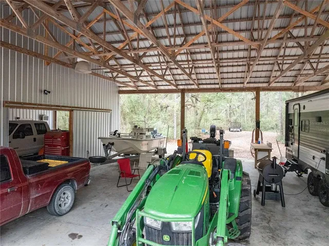a living room filled with furniture and a chandelier