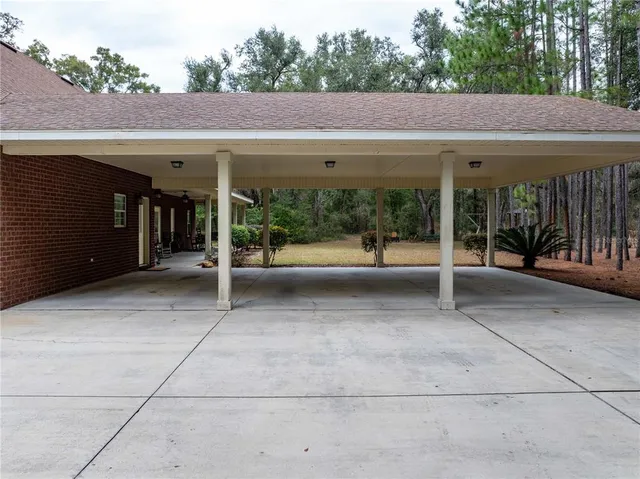 a living room with furniture and a ceiling fan