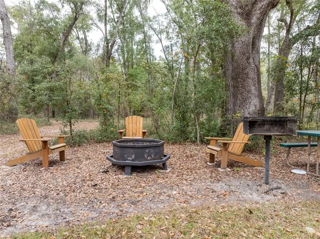 a aerial view of a house with swimming pool and porch