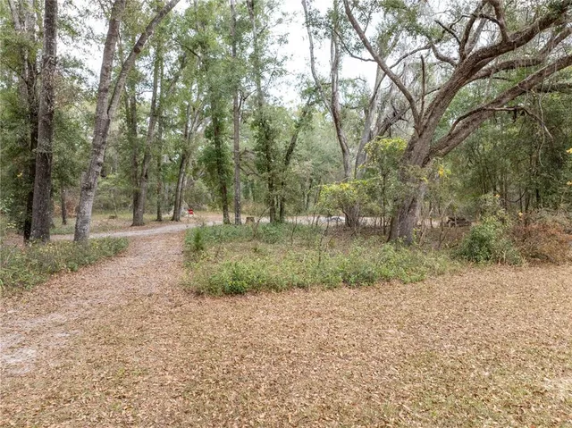 a view of outdoor space with deck and a garden