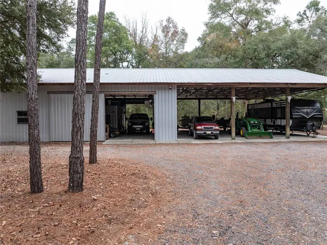 a living room with furniture and a baby crib