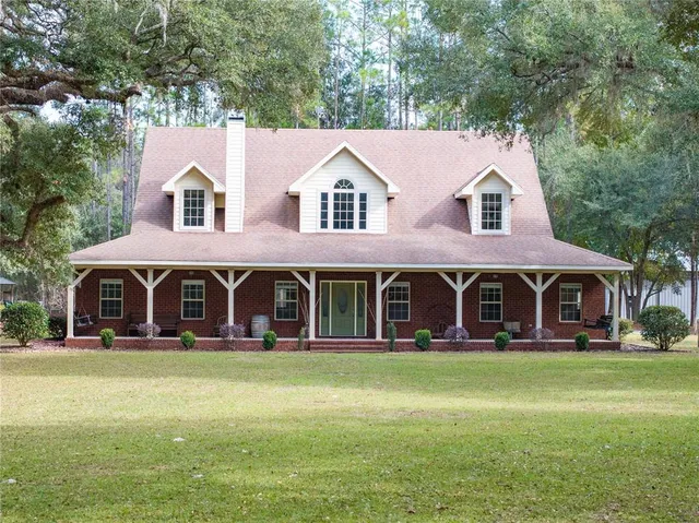 a kitchen with stainless steel appliances granite countertop a refrigerator sink and cabinets