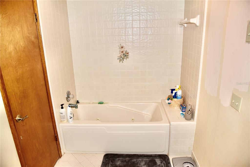8230 Lenox Avenue Jacksonville, FL 32221 - Photo 15 of 34 a white bath tub sitting next to a white wall