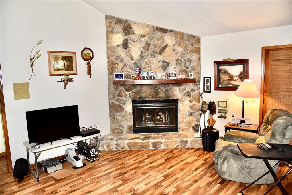 8230 Lenox Avenue Jacksonville, FL 32221 - Photo 10 of 34 a living room with furniture and a fireplace