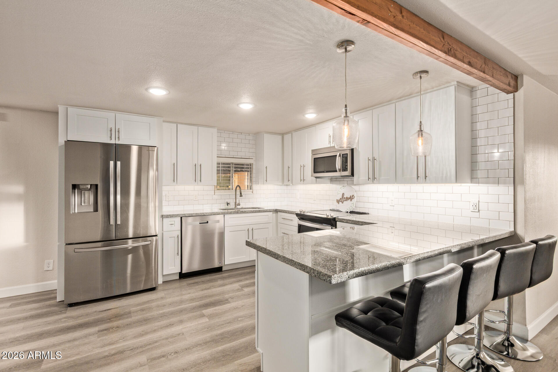 400 West Baseline Road, Unit 312 Tempe, AZ 85283 - Photo 1 of 32 a kitchen with appliances cabinets a sink and a stove