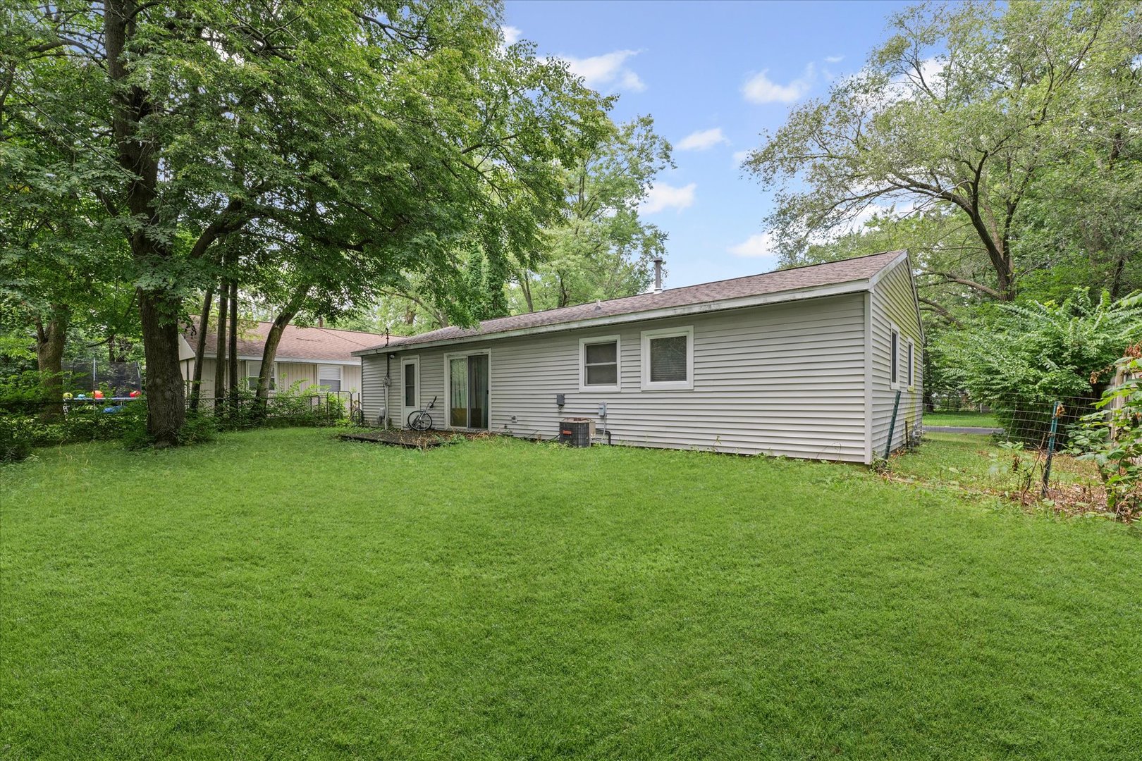 1104 Lanore Drive Urbana, IL 61802 - Photo 14 of 16 a front view of house with a garden