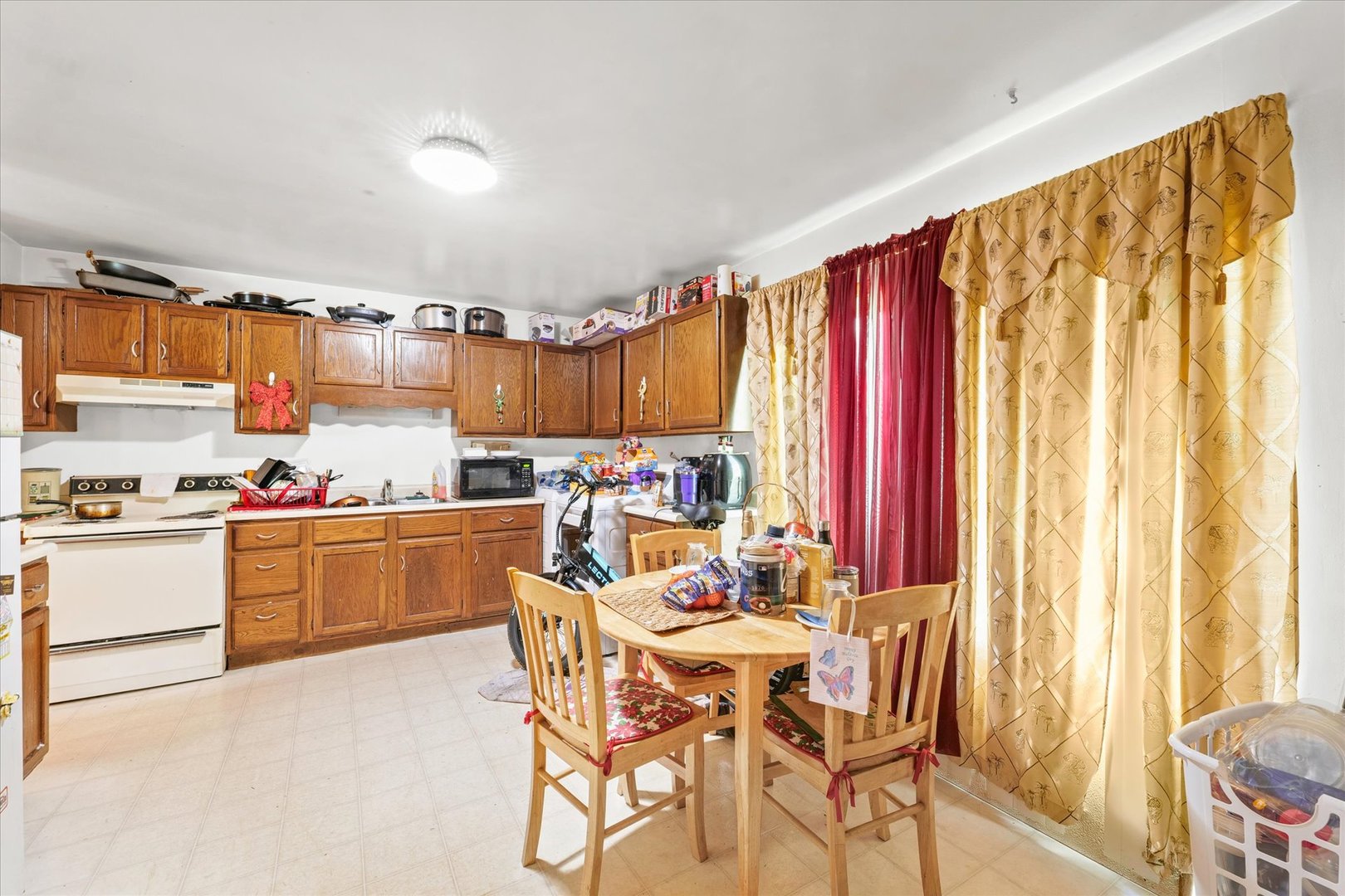 1104 Lanore Drive Urbana, IL 61802 - Photo 7 of 16 a kitchen with stainless steel appliances kitchen island granite countertop a sink and cabinets