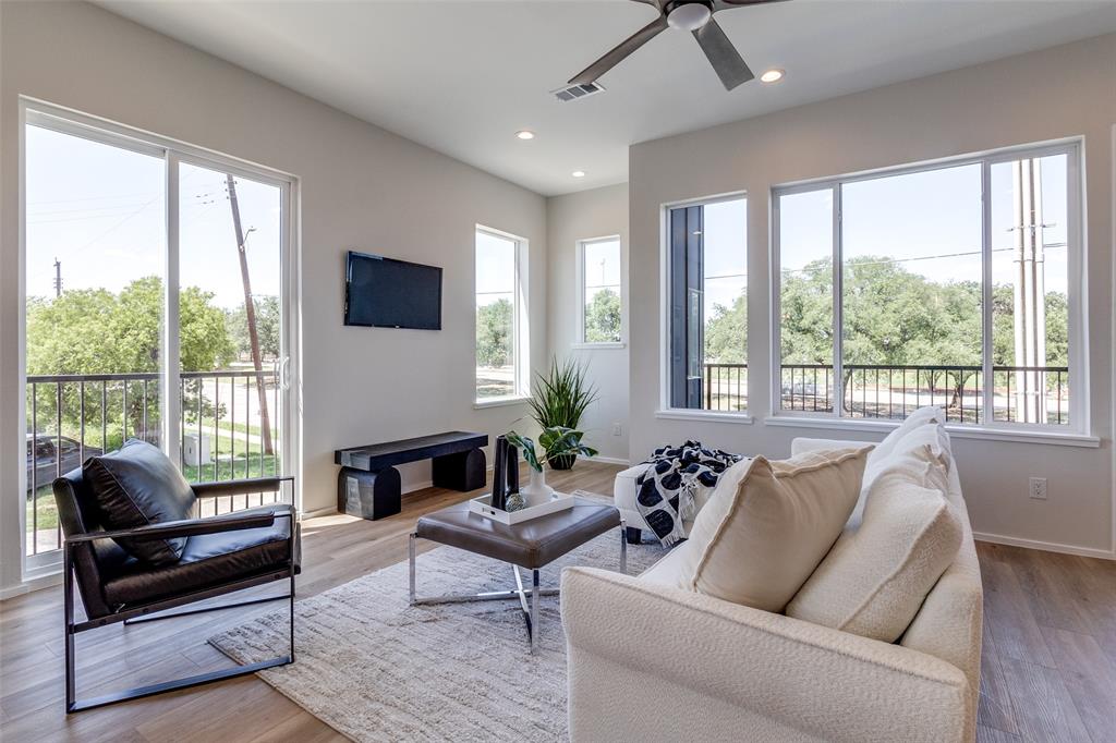3308 Birmingham Avenue, Unit C11 Dallas, TX 75210 - Photo 11 of 33 a living room with furniture and a flat screen tv