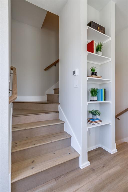 3308 Birmingham Avenue, Unit C11 Dallas, TX 75210 - Photo 29 of 33 a view of staircase with white walls and window