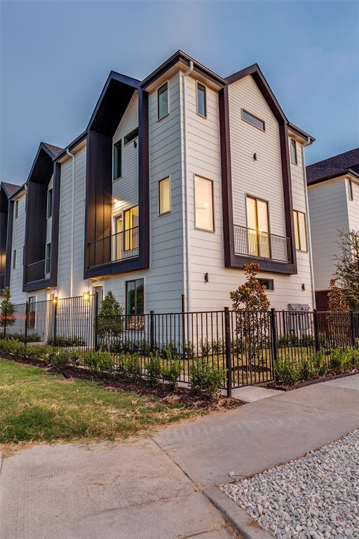 3308 Birmingham Avenue, Unit C11 Dallas, TX 75210 - Photo 6 of 33 a front view of a house with a yard