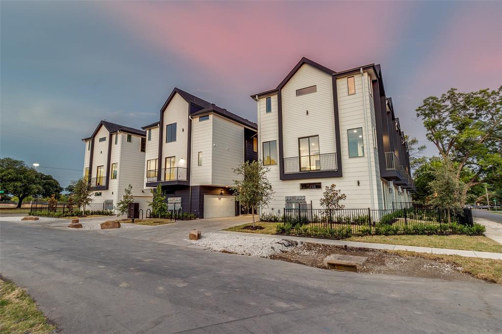 3308 Birmingham Avenue, Unit C11 Dallas, TX 75210 - Photo 8 of 33 a front view of a house with a cars parked