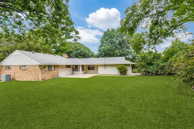 a view of a house with a garden