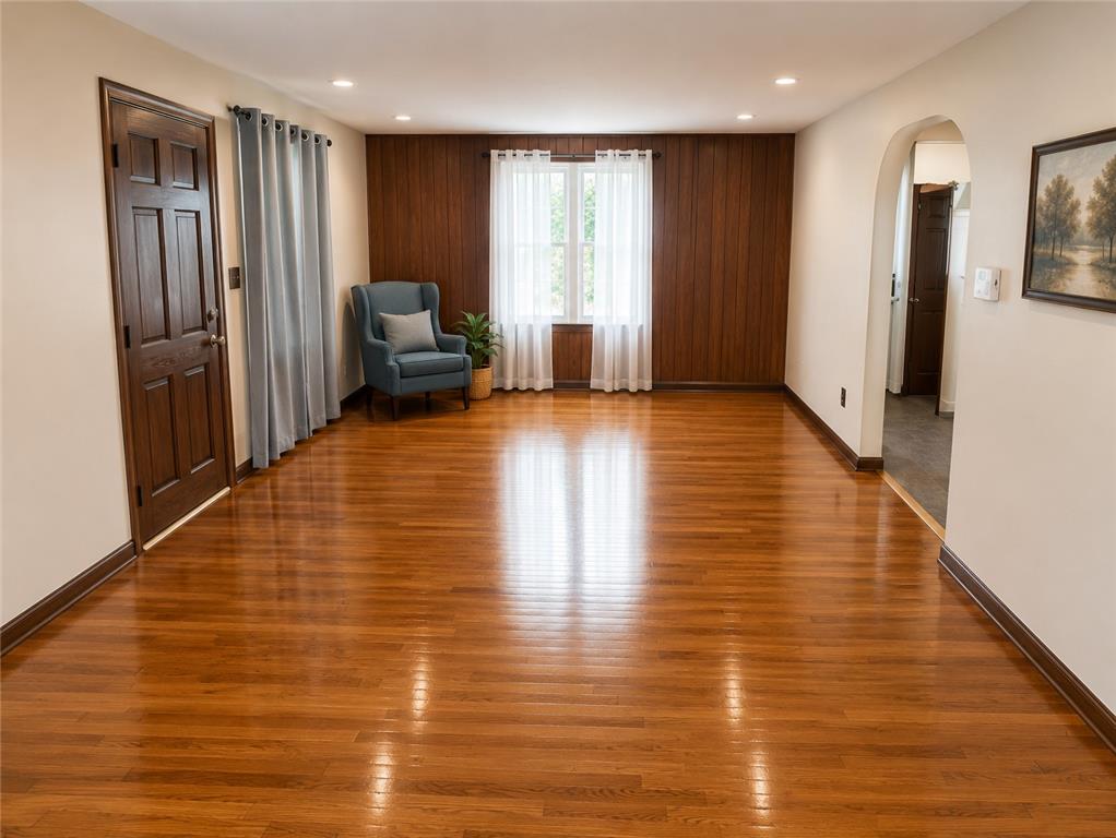 2836 Nazareth Road Easton, PA 18045 - Photo 7 of 19 Rich hardwood flooring extends throughout this well-lit living area, highlighted by a charming arched entryway.