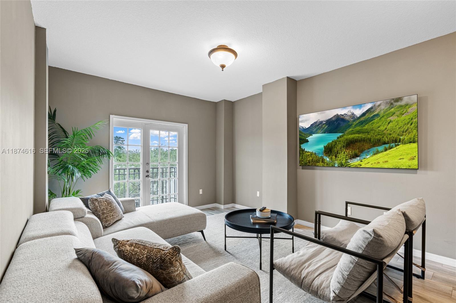 a living room with furniture and a large window