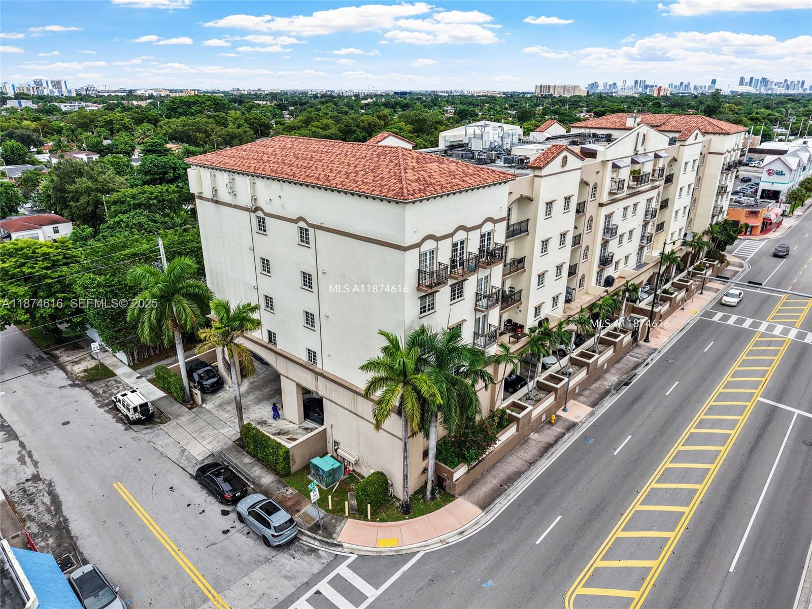 5271 Southwest 8th Street, Unit 315 Miami, FL 33134 - Photo 22 of 26 a view of a terrace with a garden